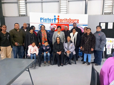 PAS Knitters Group members presenting blankets