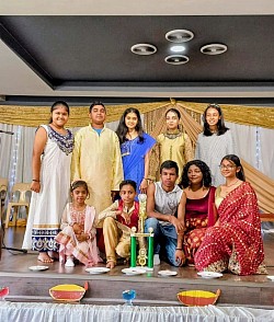 Children posing with a trophy