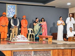 Group of people wearing indian traditional attire on a stage