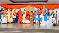 Group of people in traditional indian attire on a stage