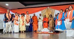 Group of people in traditional indian attire on a stage