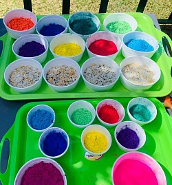 Coloured powder and grains in bowls