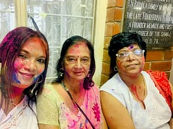 3 Females with coloured powder on their faces