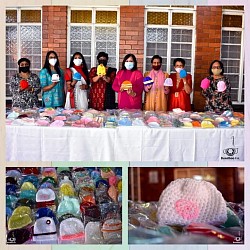 Group of women with their knitted items