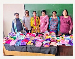 Group of women with their knitted items