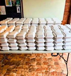 Stacks of polystyrene takeaway containers on a table